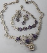 A silver, paste and marcasite demi parure, comprising a necklace, bracelet and pair or earrings.