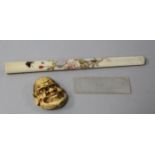 A Shibayama style cheroot holder, a Japanese ivory manju netsuke and a mother of pearl token