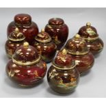 A pair of Carlton Ware Rouge Royale Pagoda ginger jars and covers, five similar small jars and