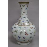 A Chinese famille rose bottle vase, Guangxu mark but later, painted with butterflies within