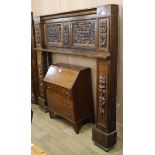 An early 20th century carved oak fire surround, from a house in Brunswick square Brighton W.188cm