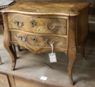 An 18th century North Italian walnut commode of small proportions, (some damage to veneers), H 44.