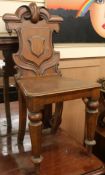 A pair of Victorian hall chairs