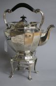 An Edwardian silver tea kettle on stand, with engraved military related inscription, Sibray,