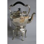 An Edwardian silver tea kettle on stand, with engraved military related inscription, Sibray,