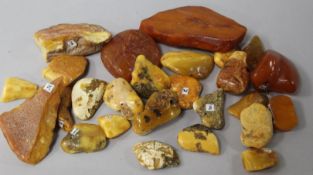 Approximately twenty six pieces of assorted raw amber.