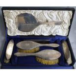 A cased George V engine turned silver six piece brush and mirror set.
