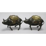 A pair of Chinese bronze, silver and copper decorated 'ox' censers and covers