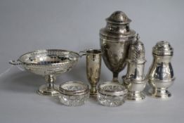 Four assorted silver condiments including an 18th century style bun pepper, a silver pedestal bonbon