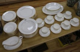 A Royal Doulton signature gold dinner service