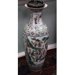 A pair of massive Chinese famille rose baluster vases, each painted to reserves with a procession of