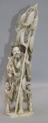 A large Chinese ivory group of a fisherman and two children, first half 20th century, the