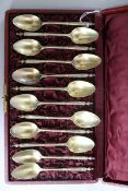 A cased set of twelve late 19th/early 20th century French silver gilt teaspoons, by Henri Souflot,