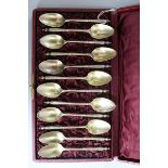 A cased set of twelve late 19th/early 20th century French silver gilt teaspoons, by Henri Souflot,