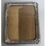 A George V silver rectangular photograph frame, James Deakin & Sons, Sheffield, 1921, 24.5cm.