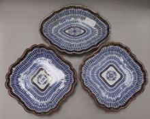 Three Worcester 'The Music Pattern' dessert dishes, Flight period, one with crescent mark, largest