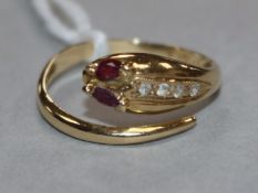 A 14ct and gem set serpent ring, size L.