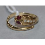 A 14ct and gem set serpent ring, size L.