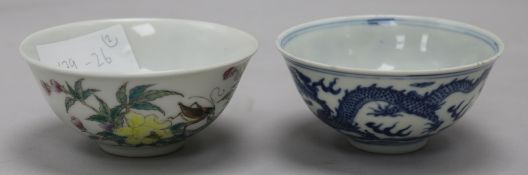 A Chinese blue and white 'dragon' bowl and a Chinese famille rose 'crickets and flowers' bowl,