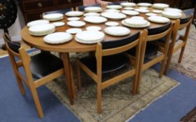 A Norwegian dining table with three extra leaves and eight dining chairs W.230cm