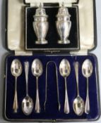 A cased set of six silver teaspoons and tongs, Sheffield, 1921 and a cased pair of silver
