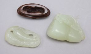 Two Chinese pale celadon jade carvings, the first a fish and a gourd, the second a bat and bitter