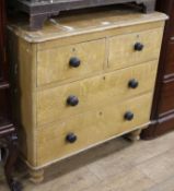 A Victorian scumbled pine chest of drawers