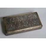 A Middle Eastern embossed white metal rectangular box, 16.1cm.