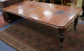 A Victorian mahogany extending dining table, with a leaf stand, W.260cm