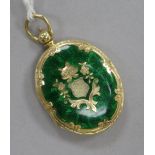 A 15ct gold and green enamel oval locket pendant, 30mm.