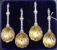 A cased set of four late Victorian parcel silver gilt 'apostle' spoons by Francis Higgins III,