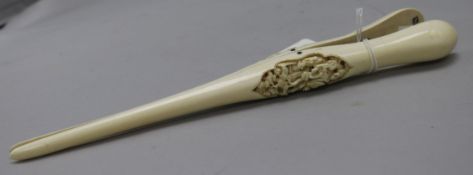 A pair of Chinese export ivory glove stretchers, late 19th century, one side carved in high relief