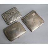 Two silver cigarette cases and a Chinese white metal cigarette case decorated with dragons and