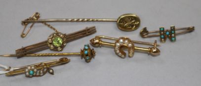 An 18ct gold and seed pearl bar brooch, a 9ct bar brooch, two other yellow metal bar brooches and