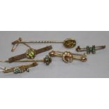 An 18ct gold and seed pearl bar brooch, a 9ct bar brooch, two other yellow metal bar brooches and