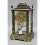 An enamel four glass clock with mercury pendulum