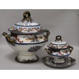 A Staffordshire pottery soup tureen and cover and another tureen and cover