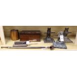 Three carved wood bear pipe racks, a 19th century tobacco cutter, a silver-mounted long pipe and