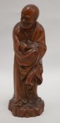 A Chinese boxwood standing figure of Luohan, on a rocky base, 23.5cm