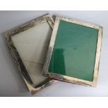 Two George V plain silver rectangular photograph frames, largest 24.3cm.