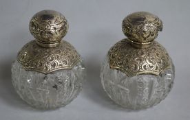 A pair of Edwardian silver mounted cut glass globular scent bottles (1 af), J.H Worrall Son & Co,