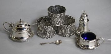 A pair of Edwardian silver napkin rings, Josiah Williams & Co, London, 1902, an earlier silver