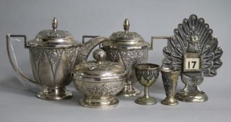 A 20th century Indonesian white metal hot milk jug and lidded sugar bowl and three other items.