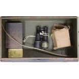 A military tin containing field binoculars and other militariaProvenance- Commander Attenborough