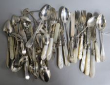 A quantity of assorted silverware, including teaspoons, cake forks, dessert eaters condiment spoon