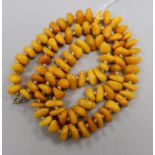 A single strand amber pebble bead necklace, gross 56 grams, 70cm.