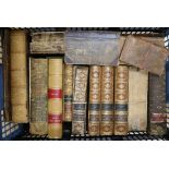 A box of mixed leather-bound books