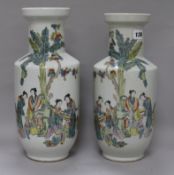A pair of Chinese famille rose rouleau vases, 20th century, each decorated with four concubines