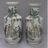 A pair of Chinese famille rose rouleau vases, 20th century, each decorated with four concubines