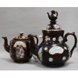 Two Bargeware teapots, height 33.5cm and 21cm